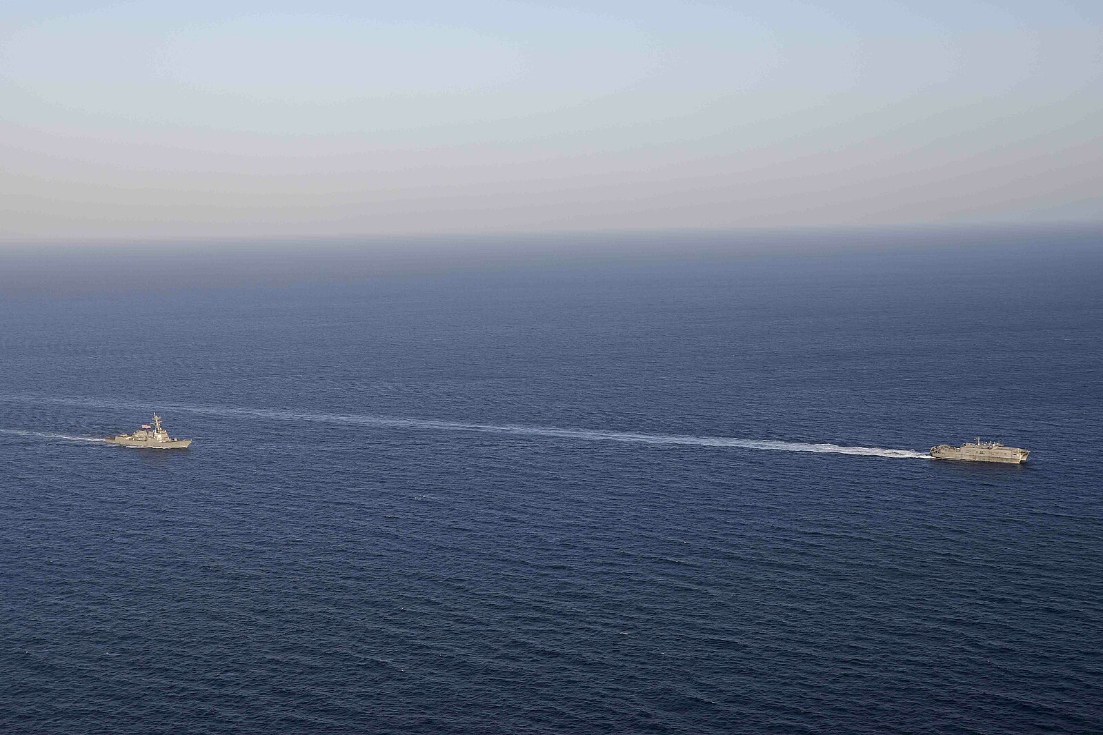 A U.S. missile destroyer trails a U.S. transport ship on May 1, 2023 (AFRICOM, https://commons.wikimedia.org/wiki/File:230501-O-DO492-686_-_Red_Sea.jpg)